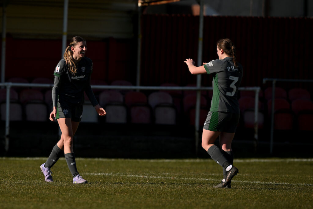 Shannon Evans of Cardiff City Women and Ffion Price of Cardiff City Women in the Genero Adran Premier Championship fixture between Briton Ferry Llansawel Ladies and Cardiff City Women FC at Old Road Welfare Ground in Briton Ferry, Wales