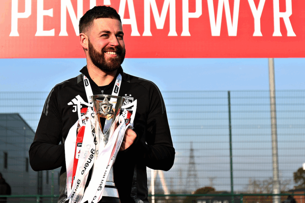 Connah's Quay manager Jordan Parry with the Genero Adran North title