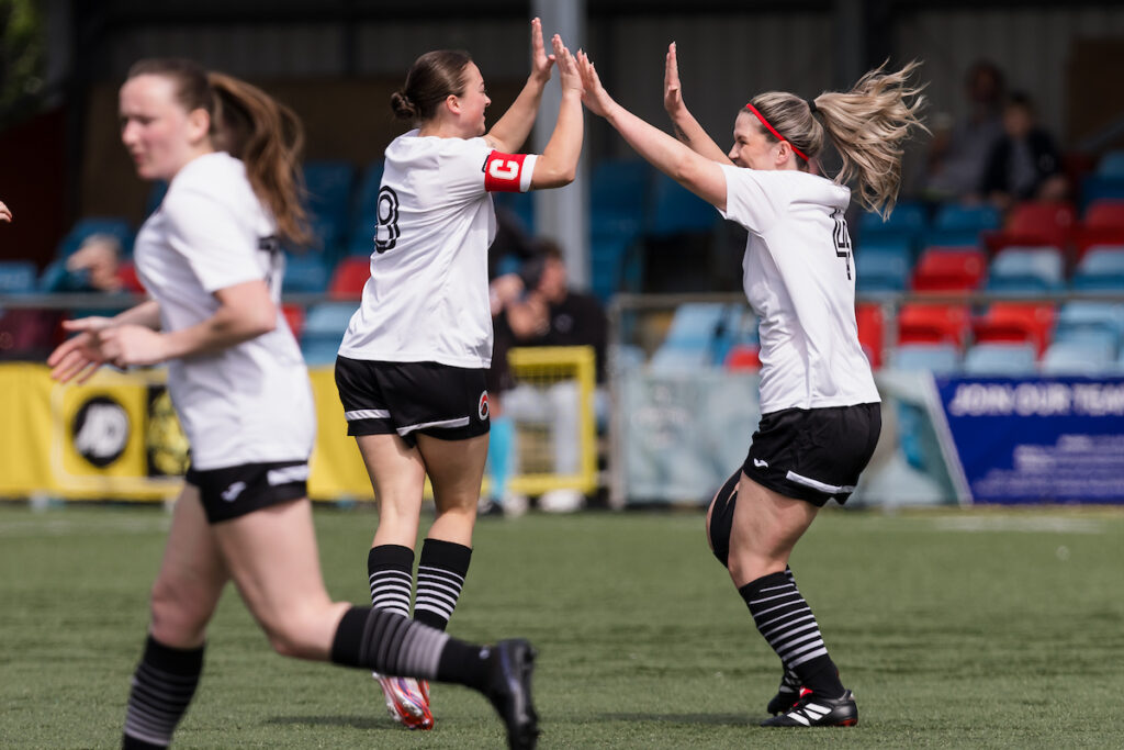 Own goal scored and Pontypridd celebrate 1-2 during the 2024/2025 Genero Adran North & South - Play-Off between Pontypridd United Women v Connahs Quay Nomads Women FC at Latham Park, Newtown, Wales