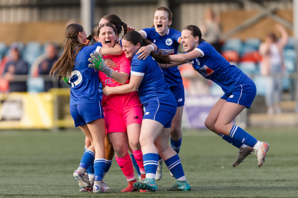 Cardiff celebrate winning on penalty kicks during the 2024/2025 Genero Adran U19's National Final between Wrexham AFC Women U19s
V Cardiff City Women FC U19 at Latham Park, Newtown, Wales