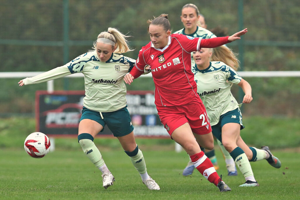 Kerry Walklett and Lili Jones battle for the ball in the Genero Adran Premier.