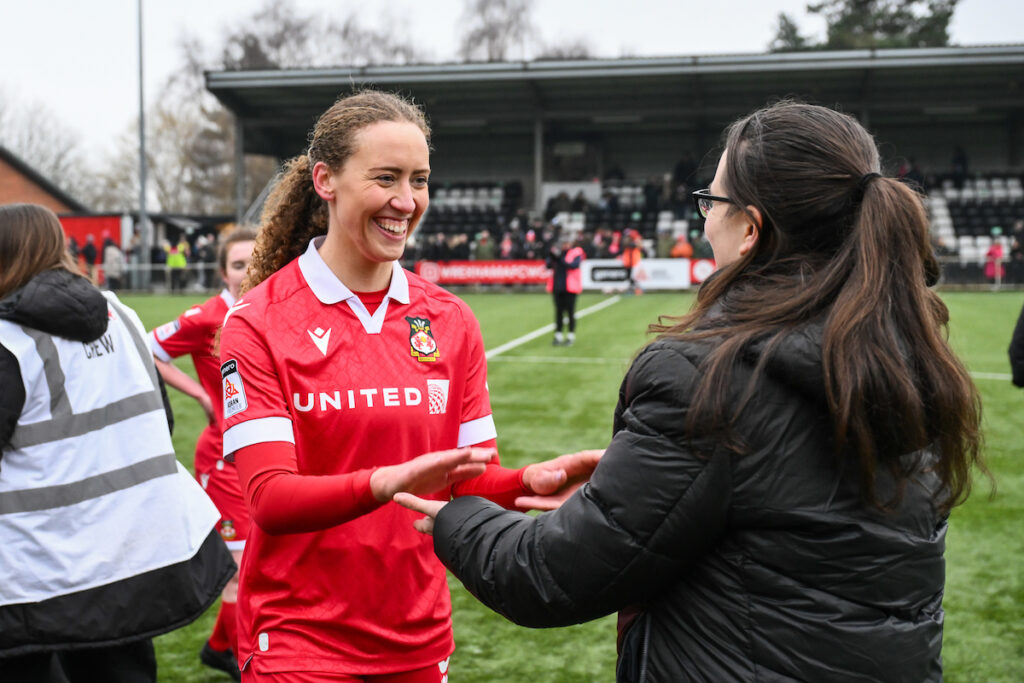 Wrexham AFC Womens' Abbie Iddenden celebrates her side victory at the end of the 2024/25 Bute Energy Welsh Cup quarter final fixture between Wrexham Women v Swansea Women at The Rock, Wrexham, Wales