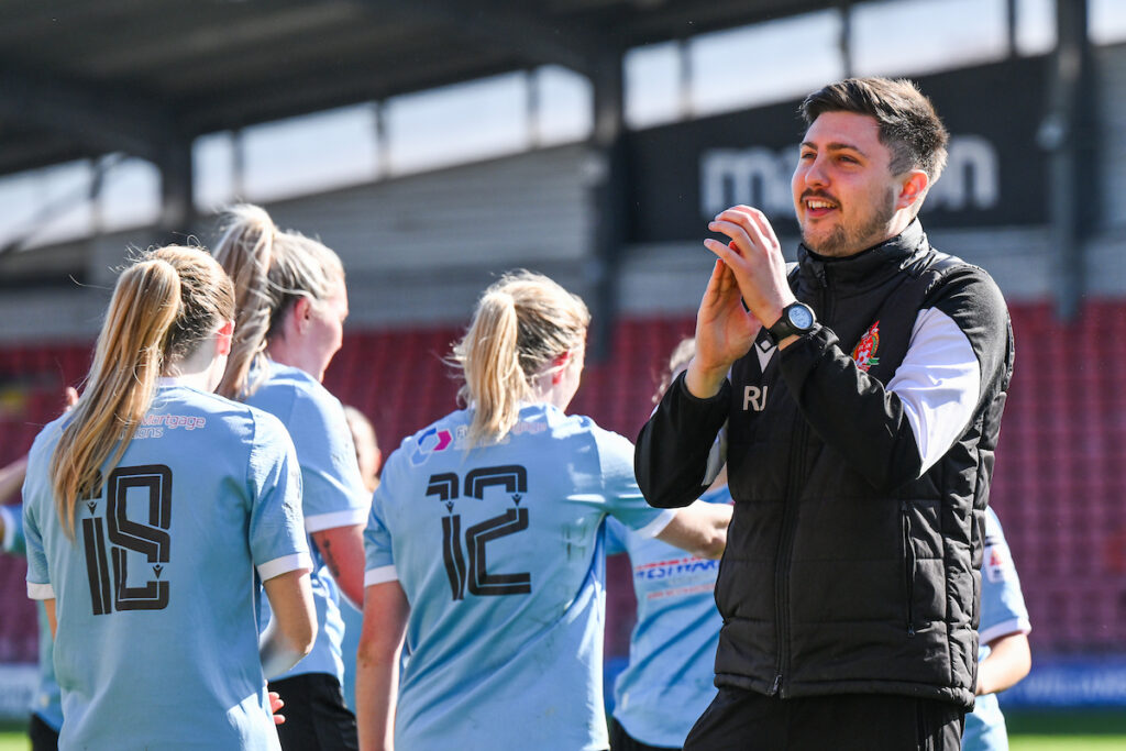 Rhys James, Head Coach of Briton Ferry Llansawel applauds the fans at the end of the 2024/25 Genero Adran Premier fixture between Wrexham & Briton Ferry Llansawel at STōK Cae Ras, Wrexham, Wales